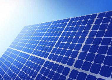 Mavi gökyüzüne karşı güneş panelleri