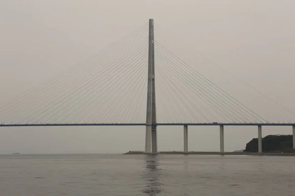 Photo of the longest cable-stayed bridge in the world - Russky, built in 2012 in the far eastern city of Vladivostok, Russia. It has long straight cables, pylons, geometrical patterns, forms, shapes