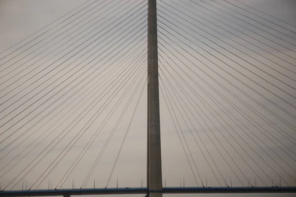 Photo of the longest cable-stayed bridge in the world - Russky, built in 2012 in the far eastern city of Vladivostok, Russia. It has long straight cables, pylons, geometrical patterns, forms, shapes