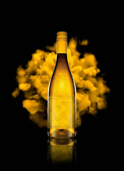Yellow smoke is coming from behind a yellow wine bottle