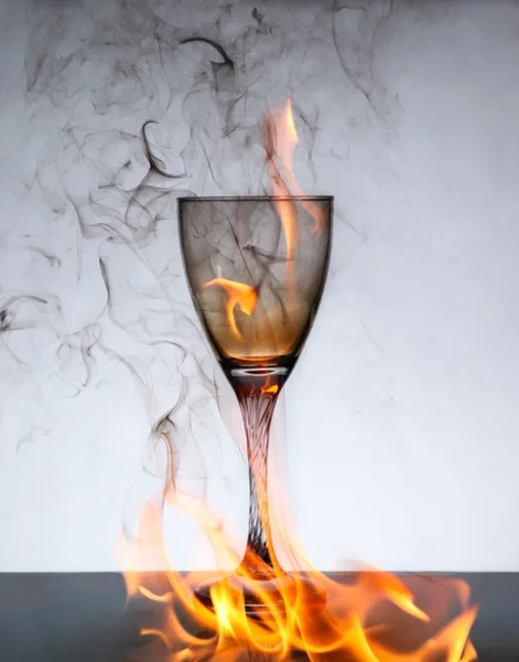 wine Glass on fire and ashes stock photo