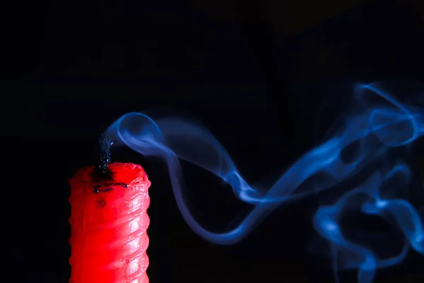 red candle blow off with smoke