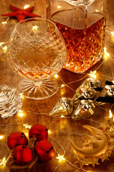 Crystal Glass Brandy Crystal Brandy Decanter Christmas Lights Christmas Bell — Stock Photo, Image