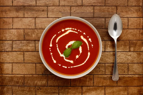 Bowl Delicious Tomato Soup Topped Drizzle Cream Sprig Basil Rustic — Stock Photo, Image