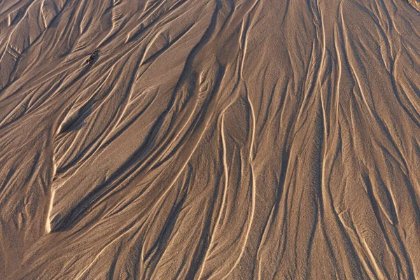 Close Image Looking Patterns Wet Sandy Beach Showing Texures Shape — Stock fotografie