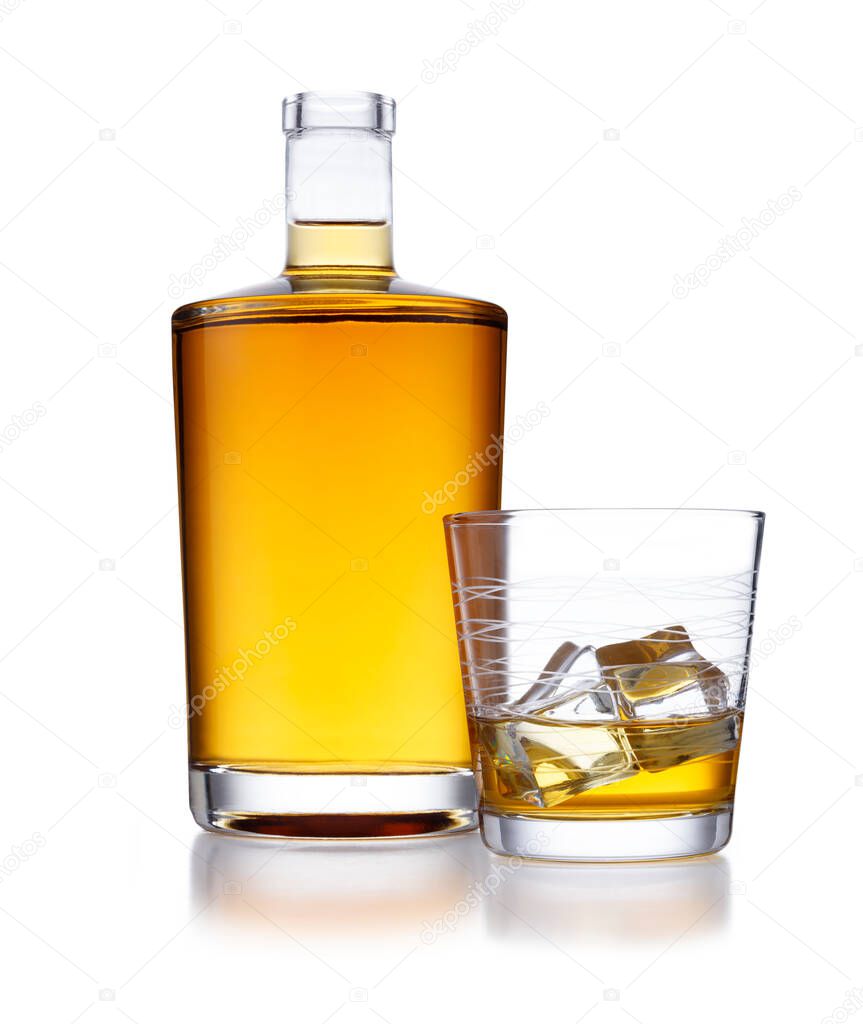 A full bottle of golden whisky, with no label or branding, and a glass of whisky and ice, isolated on white with a slight reflection