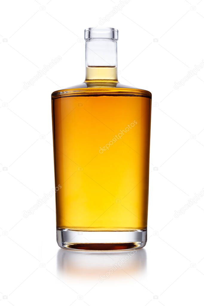 A full angular shaped bottle of golden whisky, with no label or branding, isolated on white with a slight reflection