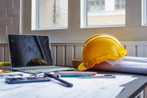 Soft Focus,The contractor has prepared a helmet to wear before entering the construction area. Safety helmets are a safety protection device in construction sites for professional construction workers