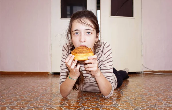 Girl Years Old Lies Floor Bites Sweet Muffin Snack — Stock Photo, Image