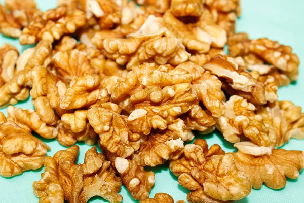 Walnut Kernels Piled Close Turquoise Background Close Selective Shot — Stock Photo, Image