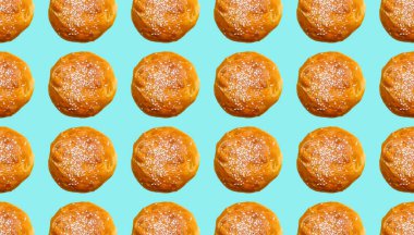 Turkuaz arka planda susam tohumları serpiştirilmiş hamburgerli kusursuz desen. Yenilebilir süs, desen.