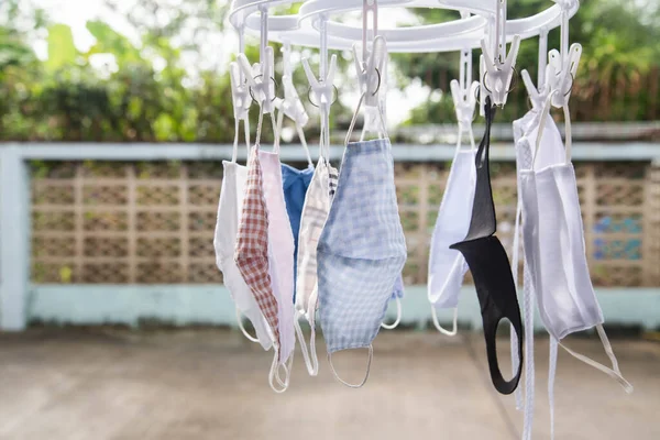 Cotton cloth mask hanging outdoor after the used and washing,natural glare light, times,after use every day should wash and dry in the sun to be sterilized as well,coronavirus