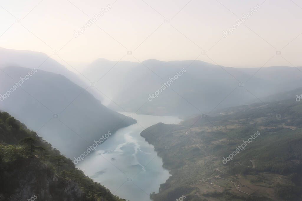 Popular lookout called Banjska stena  (Spa rock) on Tara national park, during a misty day, meandering Perucac lake and river Drina