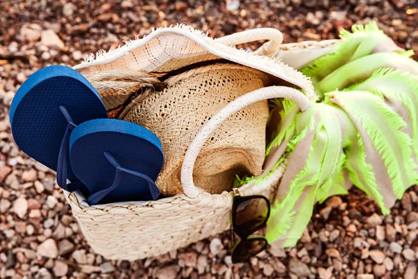 Closeup Of Straw Bag, Hat, Sunglasses And Flip Flops On The Shore In The Summer, Upper Angle View