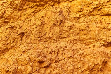 Altın arka plan ve taş yüzey dokusu, doğal desen