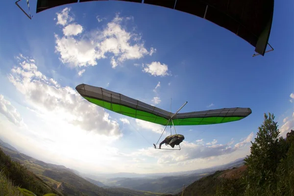 hang gliding launching in sunset at Brazil