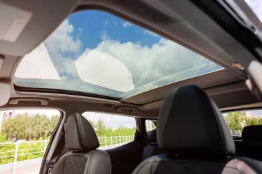 Panoramic sunroof in a car clipart