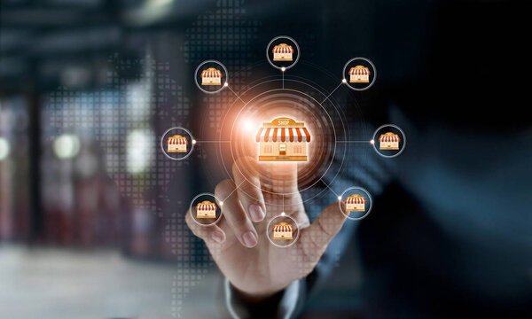 Businessman hand touching icon global network connection on franchise marketing system. Branch of market and customer. Modern technology business.
