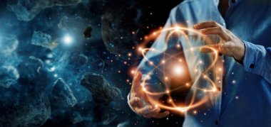 Abstract science, hands holding atomic particle, nuclear energy imagery and network connection on meteorites space planets background. clipart