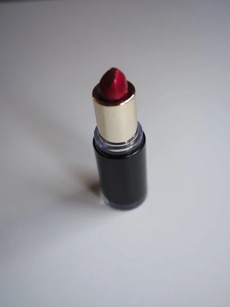 red lipstick on a white table