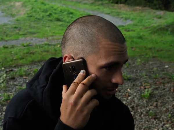 young man speaking with a mobile phone