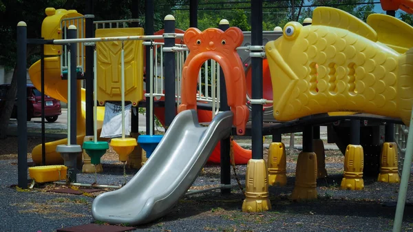 a colourful children playground equipment play ground in park of thailand.