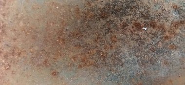 Paslı metal dokusunun eski duvar zemininde soyut pas.