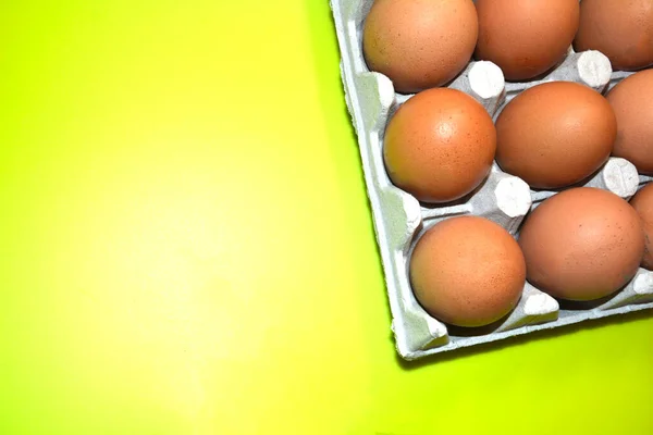 Chicken eggs in the package. There is a place for an inscription, the image of the eggs is occupied in the upper right corner