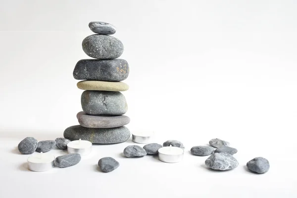 Stack stones isolated in white background. Pebbles tower. Concept of balance and harmony. Calm and spirit, spa stones and zen, peace, meditation, spiritual, abstract