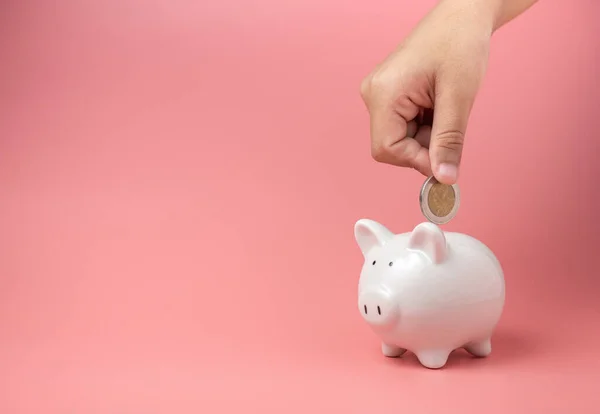 Hucha Blanca Sobre Fondo Rosa Mano Humana Poniendo Moneda Hucha — Foto de Stock