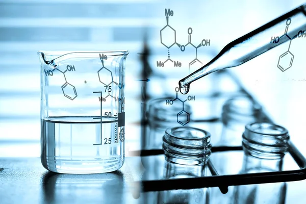 Laboratory research, dropping liquid to test tube. Test tube containing chemical liquid in laboratory, lab chemistry or science research and development concept.