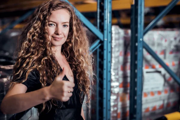Confident Caucasian woman owner standing and get thump up at goods warehouse store and check for control loading containers box from Cargo freight ship for import and export