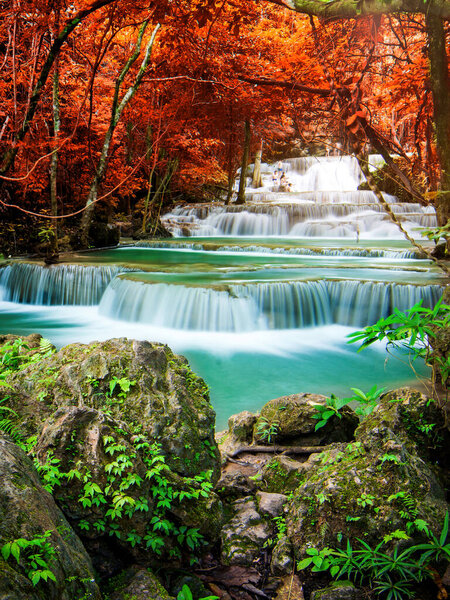 Amazing in nature, beautiful waterfall at colorful autumn forest in fall season 