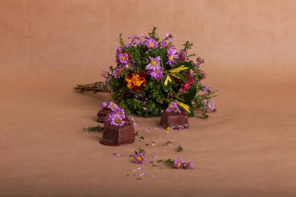 Delicious chocolate candies with flowers