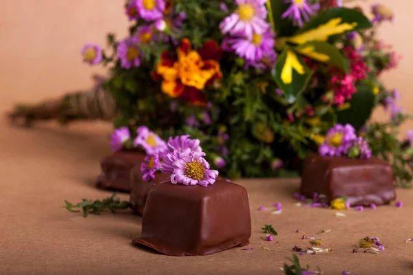Delicious chocolate candies with flowers