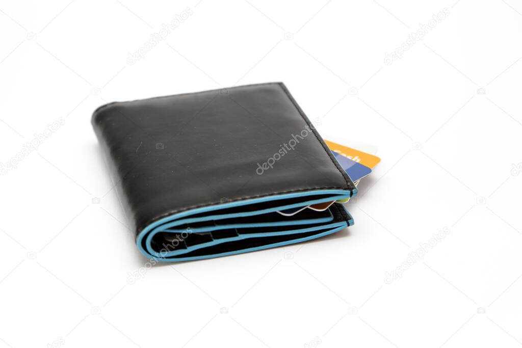 Leather wallets full of money and payment cards