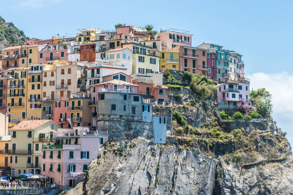 Aerial view of Manarola in Cinque Terre, beautiful town above the sea with many beautiful colorful houses