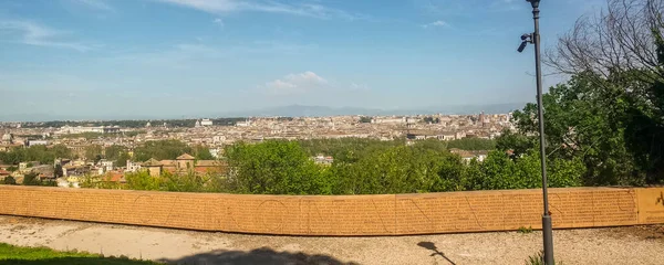 Aerial wide panorama of Rome from the wall of the Roman constitution on the Giannicolo