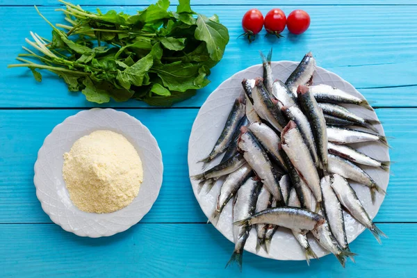 Raw sardines, vegetables and and cornflour