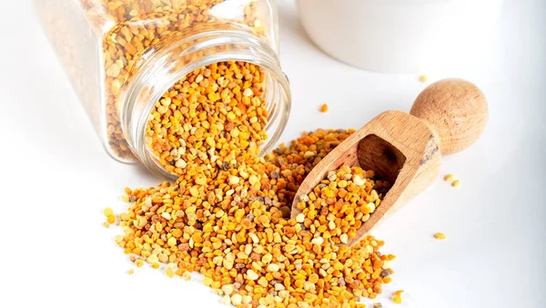 Bee pollen grains on a white background.