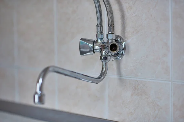 Kitchen chrome faucet is broken, horizontal view