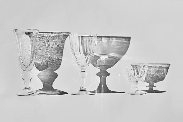 Set of empty glasses with shadows — Stock Photo, Image