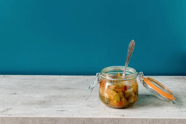 jam jar of ratatouille with vegetables in the kitchen interior, preserve vegetables