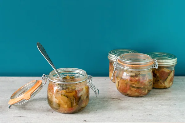 jam jar of ratatouille with vegetables in the kitchen interior, preserve vegetables