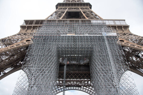 close-up eiffel tower, Eiffel Tower, landmark of Paris, during renovation process. view with iron construction detail.