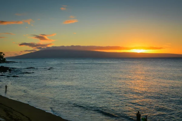 Kahana Beach in Maui, Hawaiian Islands, with view of islands of Molokai and Lanai.