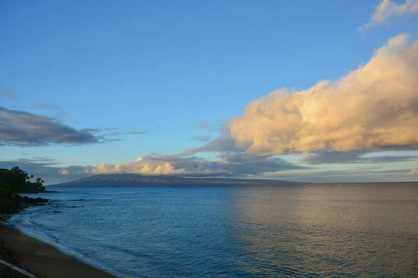 Kahana Beach in Maui, Hawaiian Islands, with view of islands of Molokai and Lanai.