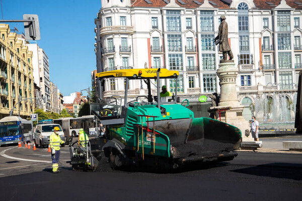 Valladolid, Spain - 02 September 2020: public workers resurfacing a road with tar, Valladolid Spain