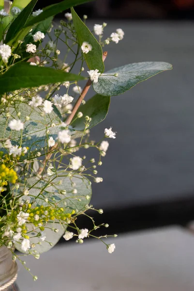 Delicate floral arrangement on table in restaurant for first baptism or first communion in Central America. Guatemala.