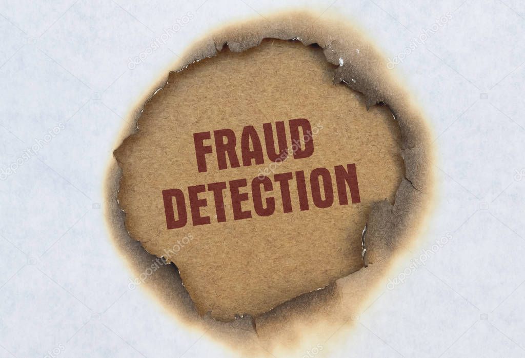 Text Fraud Detection written in red on burnt paper